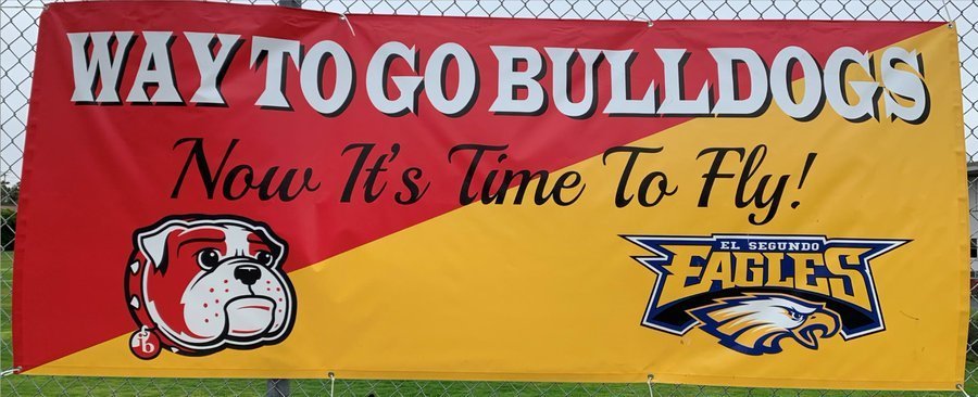 way to go bulldogs "now its time to fly" banner on a fence