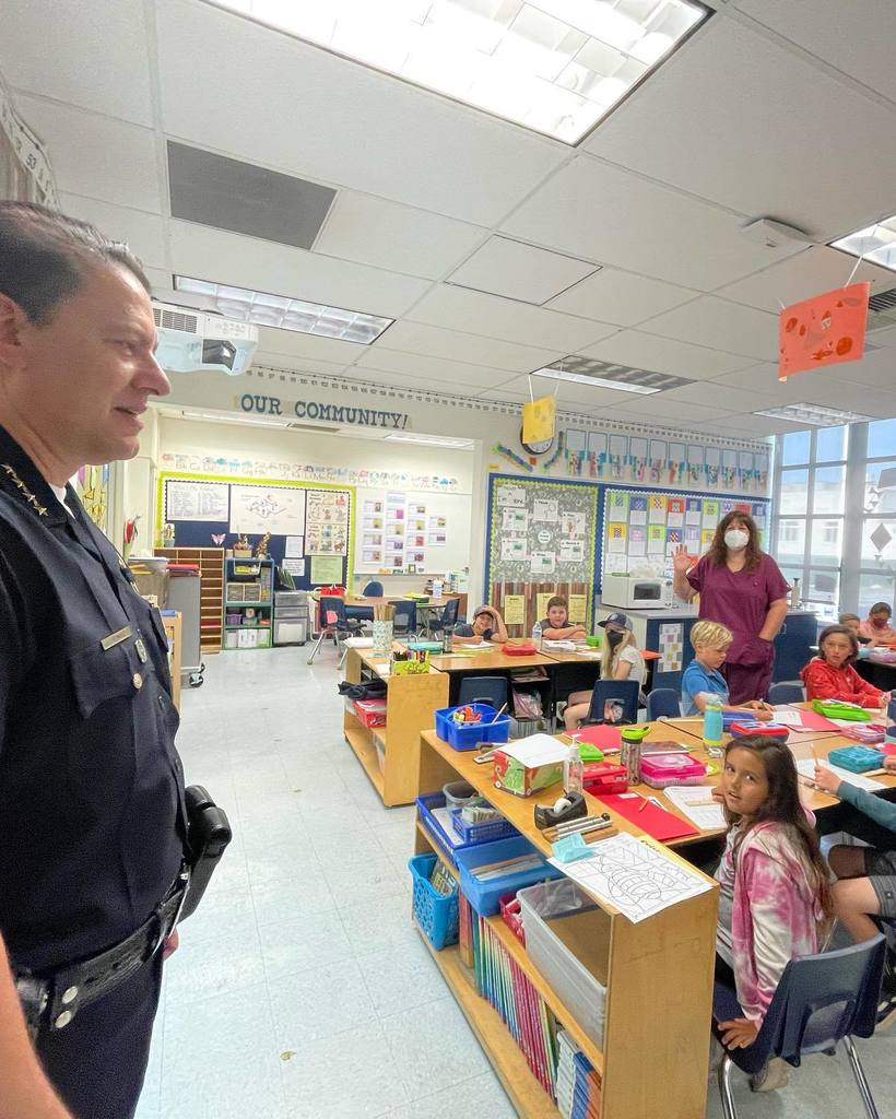 Chief Bermudez talking in a classroom with students